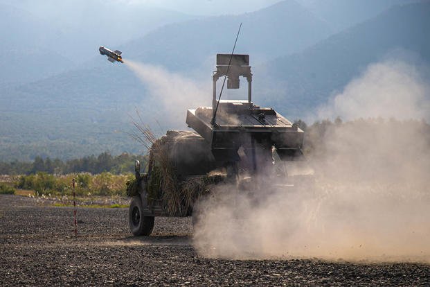 Members of Japan’s Self-Defense Force fire a missile during a joint-U.S. training exercise at Hokkaido, Japan. 