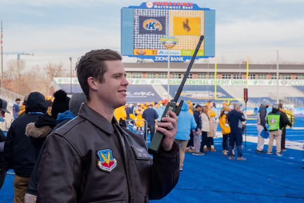 An Air Force Ground Liaison Officer coordinates a flyover before the Famous Idaho Potato Bowl.