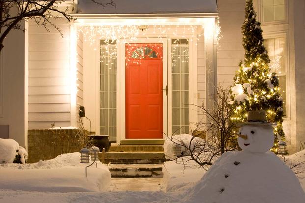 Front door of house with Christmas lights