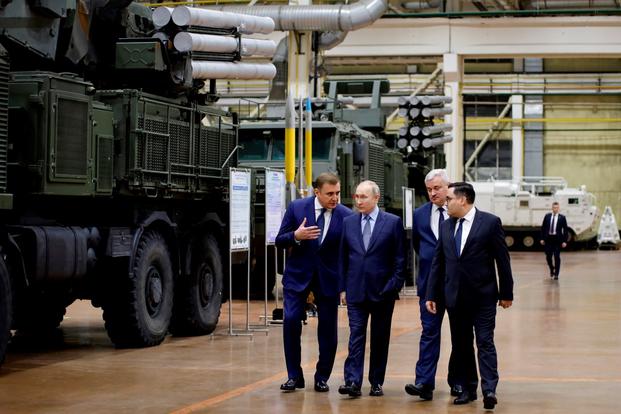 President Vladimir Putin visits a military weapons manufacturer.