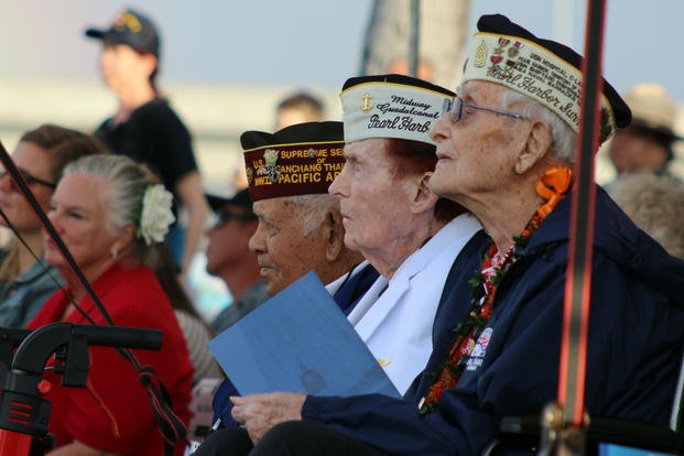 Pearl Harbor survivors observe a ceremony on Wednesday, Dec . 7, 2022.