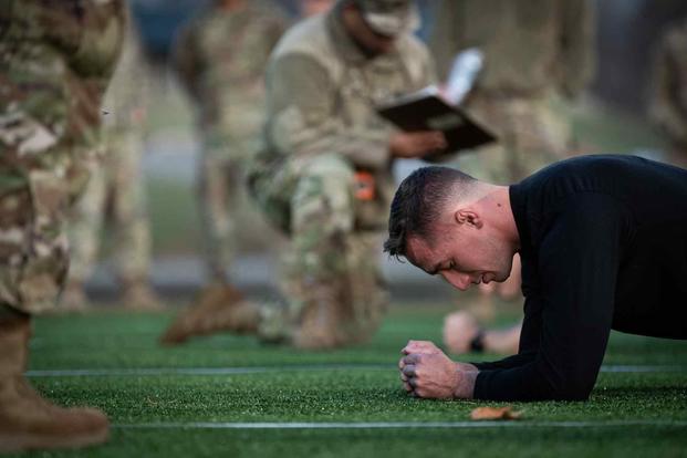 Army soldier performs planks during Army Combat Fitness Test.