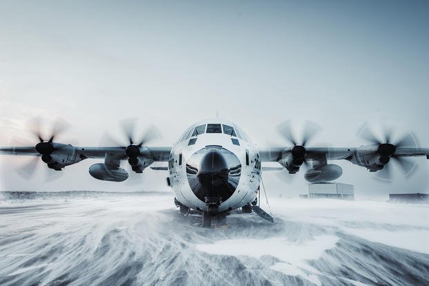 An Air Station Kodiak C-130J Super Hercules airplane prepares to depart on a runway in Bethel, Alaska.