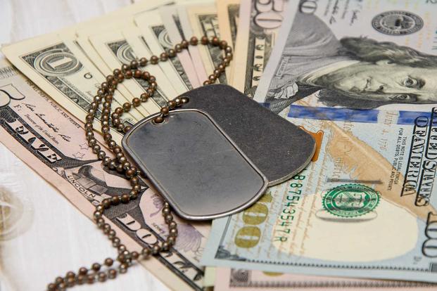 Military pay raise money and dog tags