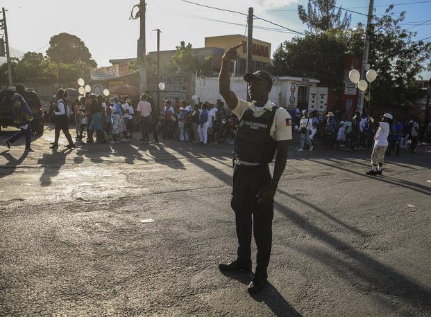 national police controls security on a street in Port-au-Prince, Haiti