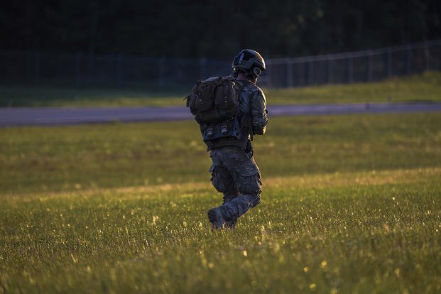 A U.S. Air Force special tactics airman assigned to the 24th Special Operations Wing runs across the landing zone during Exercise Emerald Warrior 16 at Camp Shelby Joint Forces Training Center, Miss.