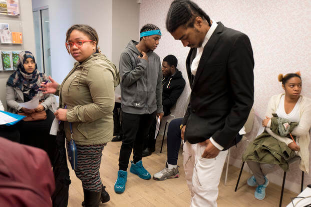 Job seekers wait to meet with recruiters during a job fair hosted by the Gregory Jackson Center for Brownsville, in the Brooklyn borough of New York.