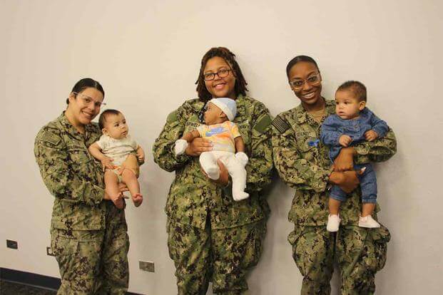 Mothers with their babies pose for a photo at Naval Base Coronado.