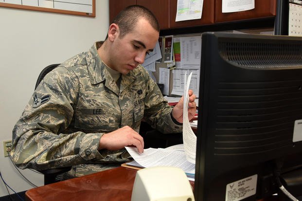 Airman 1st Class Ryan Lee, a 341st Missile Wing military justice paralegal, reviews an Article 15 at the Malmstrom Air Force Base, Montana, legal office.