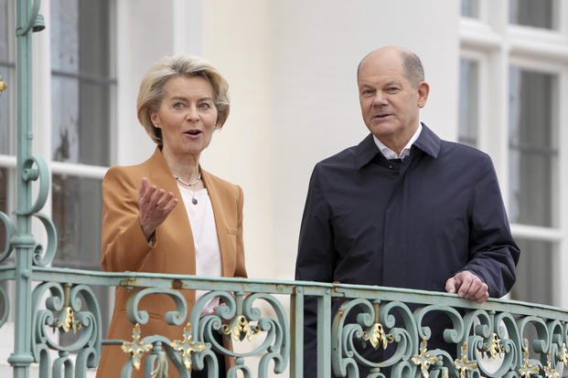 German Chancellor Olaf Scholz, right, welcomes European Commission President Ursula von der Leyen