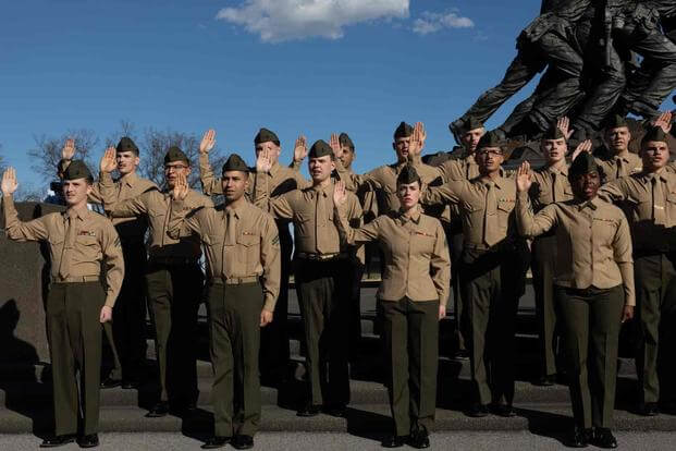 U.S. Marines reenlist at the Marine Corps War Memorial.