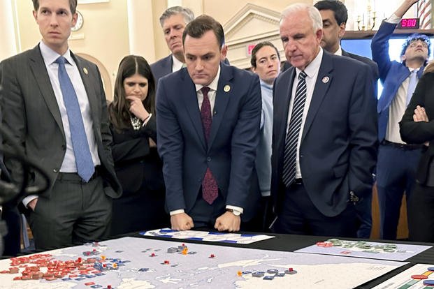 Lawmakers gather for a tabletop war game exercise.