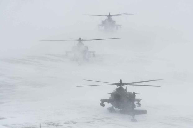 Apache helicopters prepare to conduct aerial gunnery at Fort Wainwright.