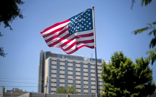 American flag flies in front of the Atlanta VA Medical Center in Atlanta.