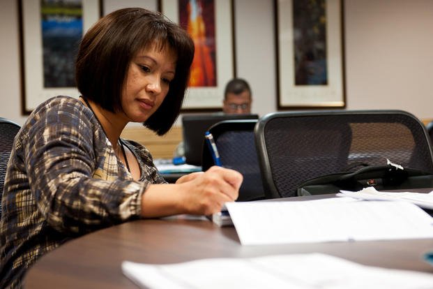 Maj. Evangeline Vida takes notes during a Transition Assistance Program class in the Airmen and Family Readiness Center on Ellsworth Air Force Base, S.D.