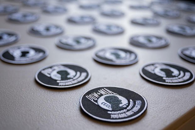 POW/MIA patches sit on a table during a POW/MIA ceremony
