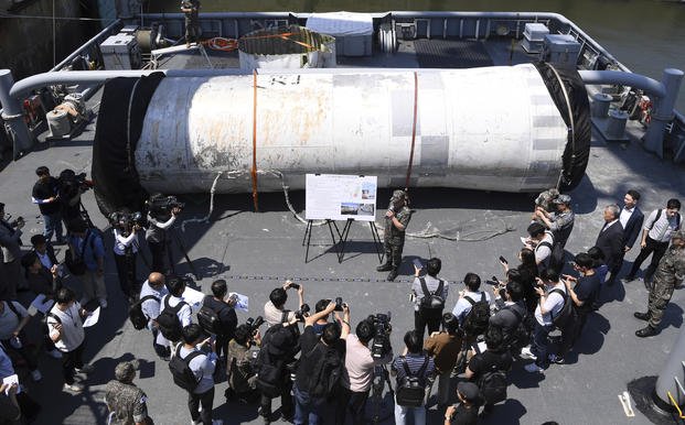 Objects salvaged by South Korea's military that are presumed to be parts of the North Korean space-launch vehicle
