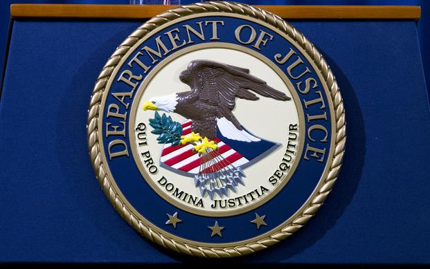 The Department of Justice seal is seen in Washington