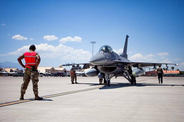 U.S. Air Force Tech. Sgt. Damian Dorsey, aircraft armament systems technician, from the 113th Aircraft Maintenance Squadron out of Washington D.C., conducts pre-flight procedures for an F-16 Fighting Falcon during Red Flag 23-3, at Nellis Air Force Base, Nevada, July 19, 2023.
