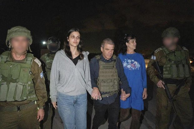 Judith Raanan, and her daughter Natalie are escorted by Israeli soldiers