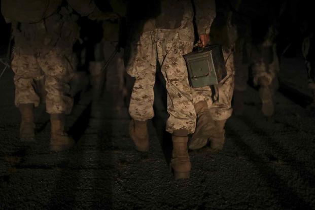 Recruits hike during Crucible aboard Marine Corps Depot Parris Island