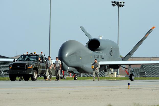 Airmen from Grand Forks Air Force Base welcome the first RQ-4 Global Hawk to the base May 26. 