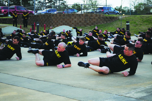 Incoming soldiers stretch out after a run during newcomers PT at Fort Polk, Louisiana.