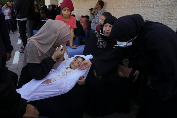 A mother cries for her daughter who was killed in the Israeli bombardment.