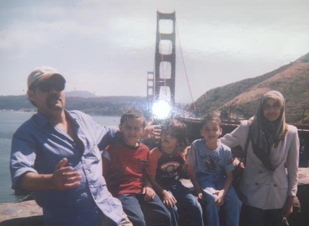Family photo with the Golden Gate bridge in the background. 