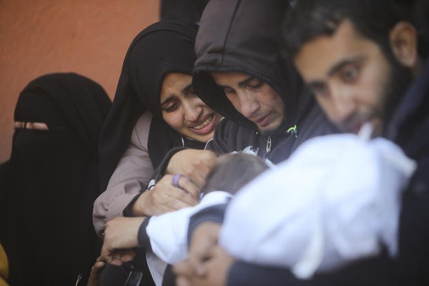 Palestinians mourn for relatives killed in the Israeli bombardment of the Gaza Strip.