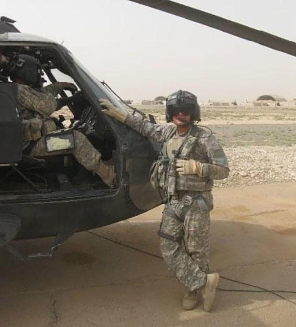 Army Sgt. Brandon Phillips works as a Black Hawk crew chief and repairman in Kirkuk, Iraq, in 2009.