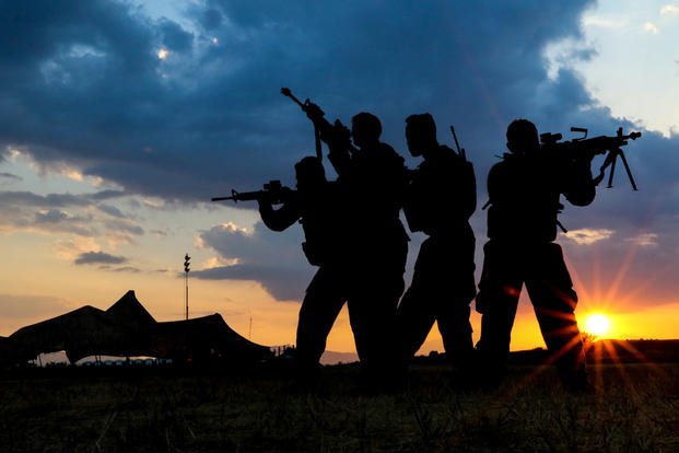 U.S. Army soldiers pose for photos during a training exercise in 2019. 