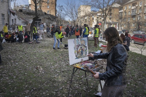 Kyiv State Arts Academy student paints outside in Kyiv, Ukraine.