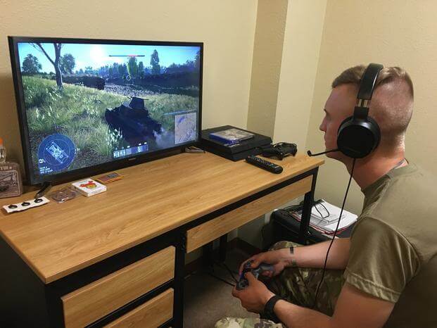 Sgt. David Ose, a section leader in D Troop, 6th Squadron, 9th Cavalry Regiment, 3rd Brigade Combat Team,1st Cavalry Division, plays an online game that the unit is using to help maintain readiness while protecting the force. 