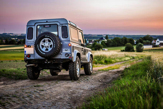 The iconic Land Rover Defender is nothing like its luxurious American counterparts, and that’s a good thing. 