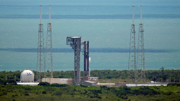 Boeing's Starliner capsule, atop an Atlas V rocket, sits on the launch pad
