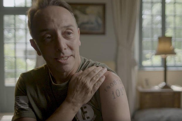 Actor Mark Lawrence, who portrayed Cpl. William H. Dukeman Jr. in 'Band of Brothers,' presents his tattoo of Dukeman's service number. (New War Productions)