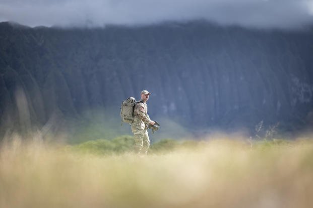 U.S. Air Force Staff Sergeant Michael Murphy, a photographer with 4th Combat Camera, documents preparation for an amphibious assault at Bellows Air Force Station, Hawaii.