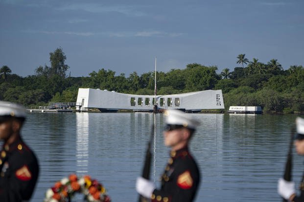 U.S. Marines fire a salute during the 82nd Pearl Harbor Remembrance Day ceremony in front of the USS Arizona Memorial at Pearl Harbor in Honolulu on Thursday.