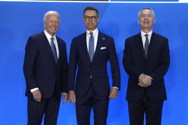 President Joe Biden, left, and NATO Secretary General Jens Stoltenberg, right