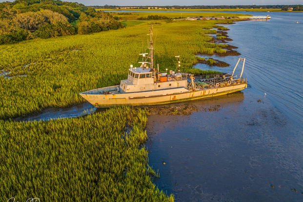 A 120-foot-long, welded steel former Navy minesweeper is stuck on Bohicket Creek near Seabrook Island in South Carolina. 