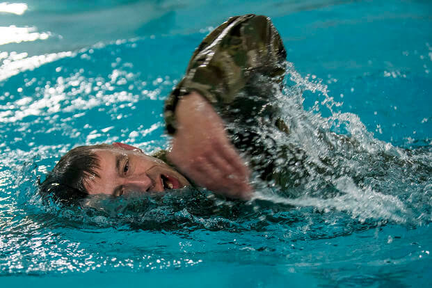 A U.S. Army Reserve paralegal specialist participates in a 100-meter swim during the 200th Military Police Command's Best Warrior Competition at Fort Hunter Liggett, California.