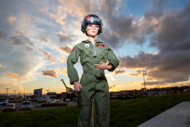 A female U.S. Navy aviator Barbie doll of the character Natasha "Phoenix" Trace, from the movie ‘Top Gun: Maverick,’ is posed in Teterboro, New Jersey, on Monday, Nov. 22, 2021. Barbie has represented every long-standing U.S. military branch except the Coast Guard. (Ted Shaffrey/AP Photo)