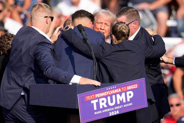 Republican presidential candidate former President Donald Trump is surrounded by Secret Service