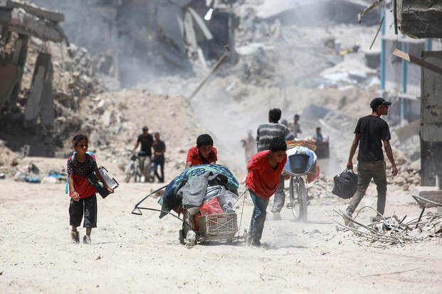 Displaced Palestinians return to Bani Suhayla and neighboring towns east of Khan Yunis following reports of Israeli forces withdrawing from the area in the southern Gaza Strip on July 30, 2024, amid the ongoing conflict between Israel and the Palestinian Hamas militant group.