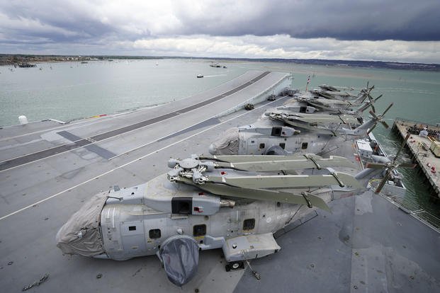 Royal Navy Merlin helicopters on the flight deck of the HMS Queen Elizabeth