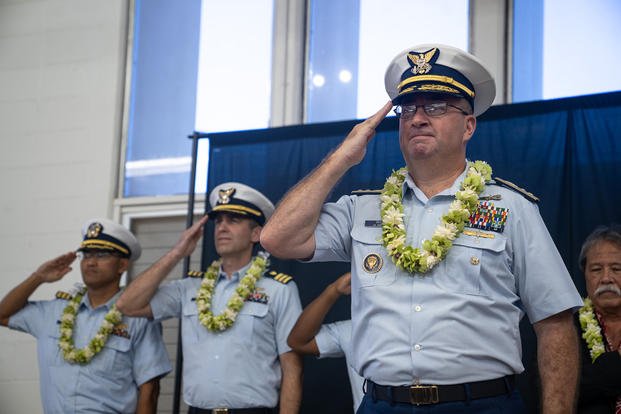 Coast Guard Rear Adm. Sean Regan, commander, District Fourteen, salutes during a ceremony at Kalani High School in Honolulu, Hawaii, Nov. 21, 2024. The Coast Guard established its first Hawaii-based JROTC unit, also the 14th Coast Guard JROTC in the U.S. 