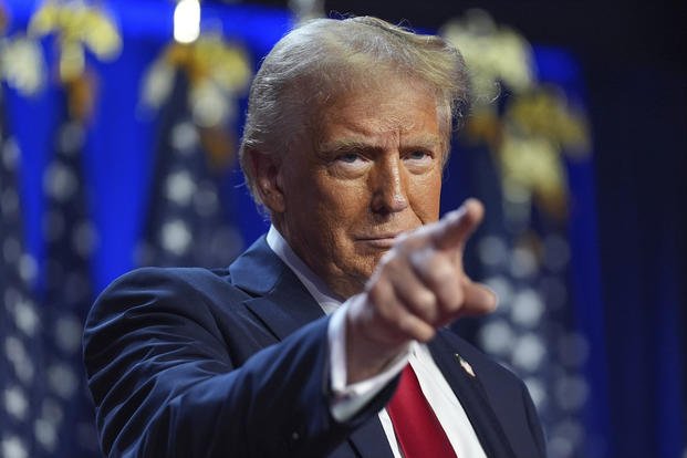 Republican presidential nominee former President Donald Trump arrives at an election-night watch party at the Palm Beach Convention Center in West Palm Beach, Fla. 