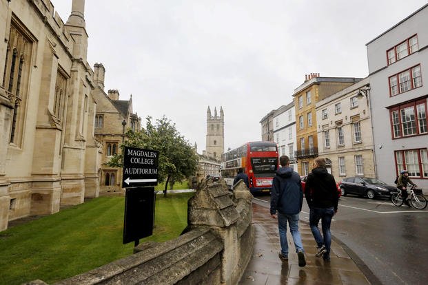 People walk around Oxford University's campus on Sept. 3, 2017.