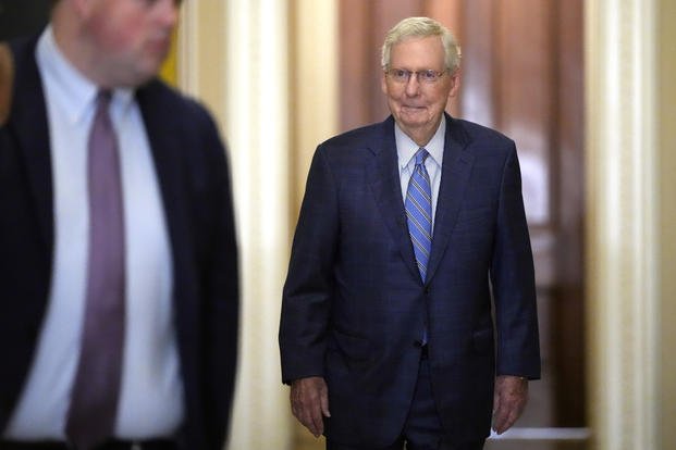 Outgoing Senate Minority Leader Mitch McConnell, R-Ky., arrives for a meeting of Senate Republicans